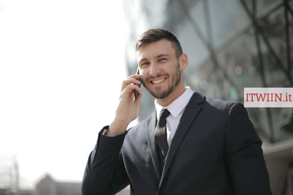 Man in Black Suit Jacket Holding Smartphone