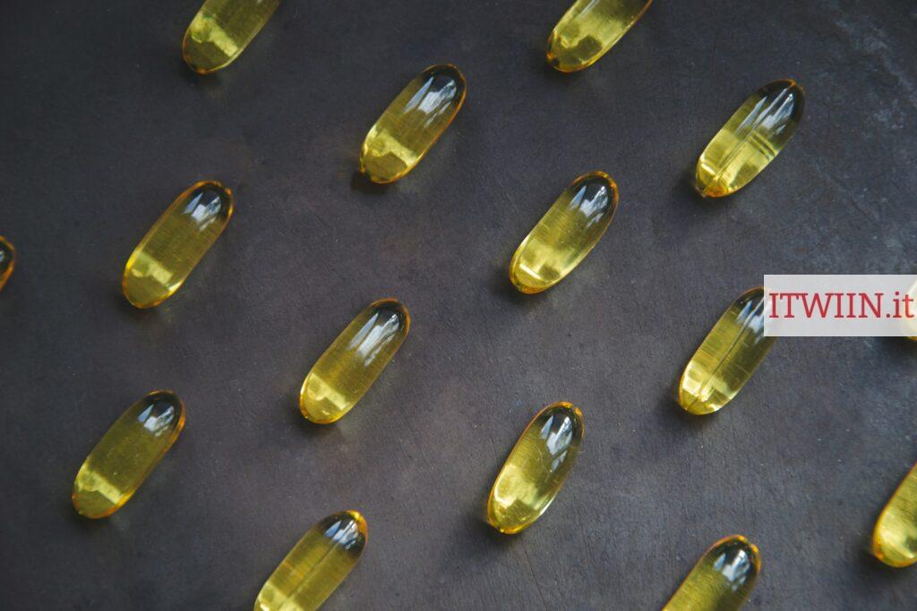 a bunch of yellow pills sitting on top of a table