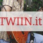 person holding brown guitar outdoor
